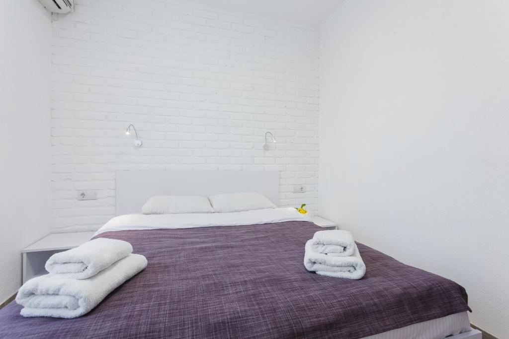 Postel nebo postele na pokoji v ubytování SkyHome na Nauky