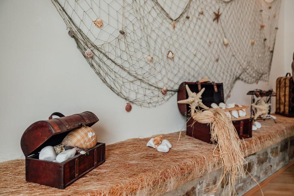 a table with some boxes on top of it at Stone House Herceg Novi in Herceg-Novi