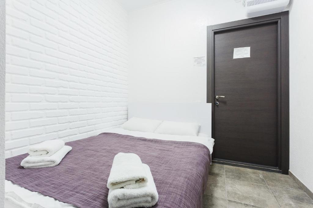 Postel nebo postele na pokoji v ubytování SkyHome na Nauky