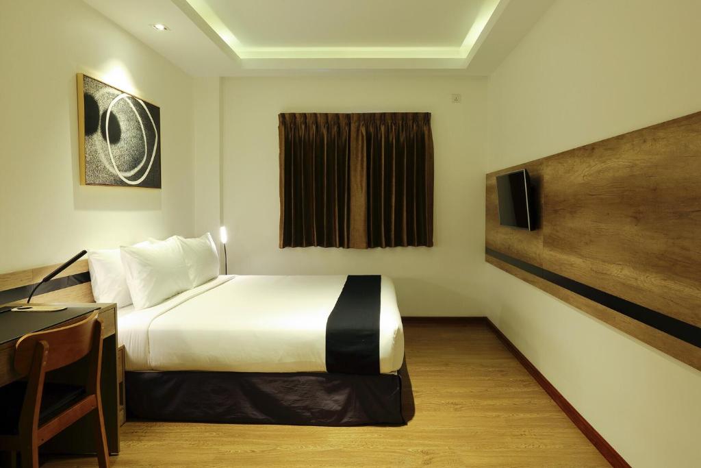 Letto o letti in una camera di K.C Hotel