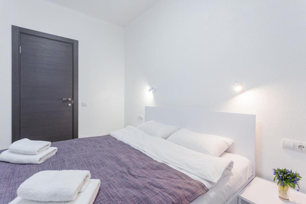 Postel nebo postele na pokoji v ubytování SkyHome na Nauky