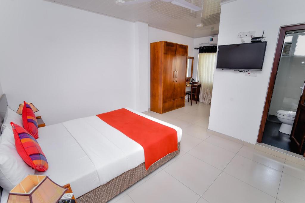 Postel nebo postele na pokoji v ubytování My City Hotel