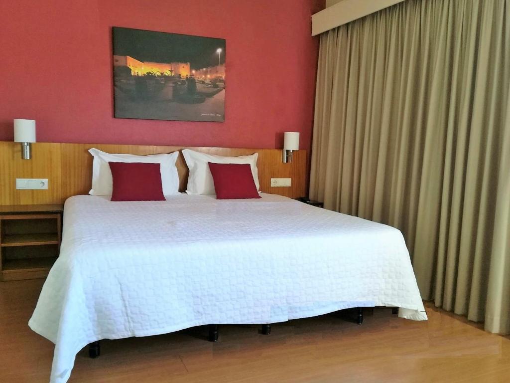 Postel nebo postele na pokoji v ubytování Hotel Dom Vilas