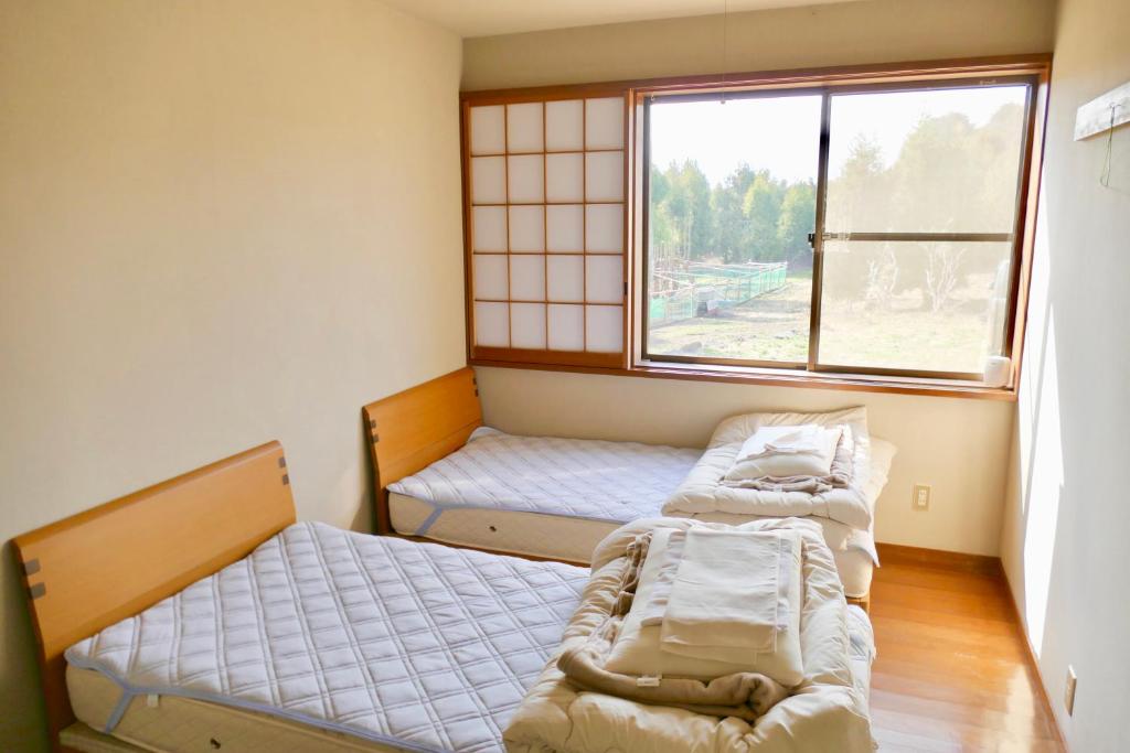 Letto o letti in una camera di FWA Guest House