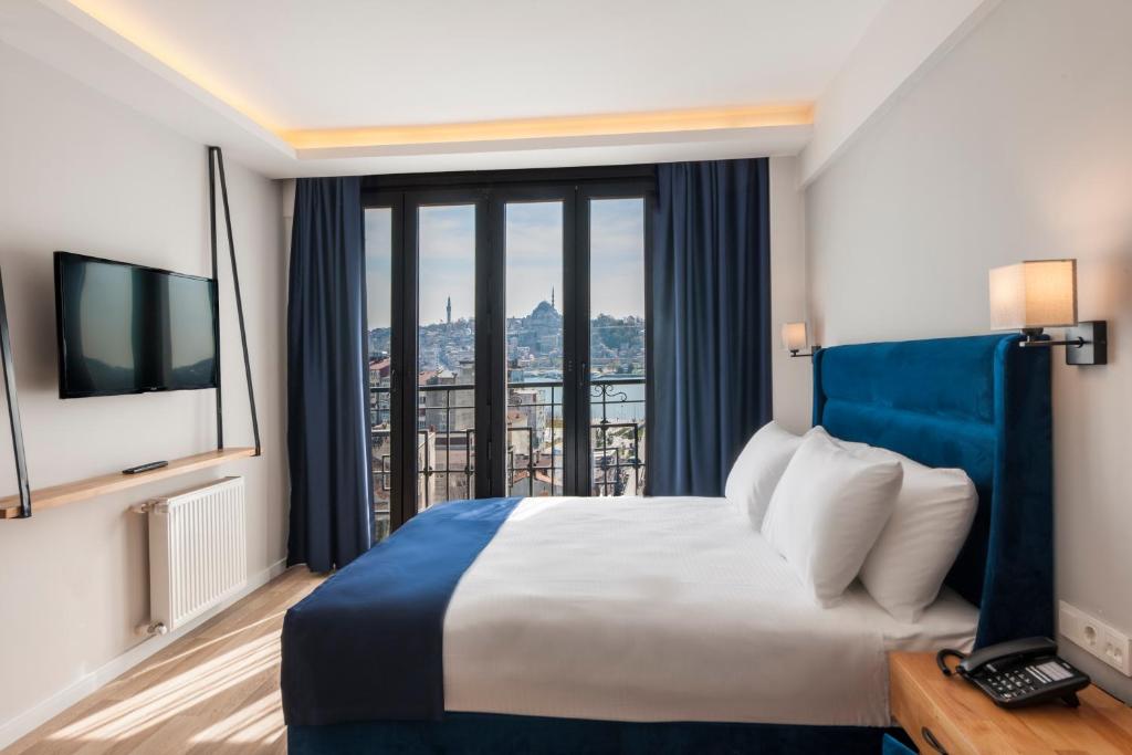 Postel nebo postele na pokoji v ubytování DORUK PALAS HOTEL