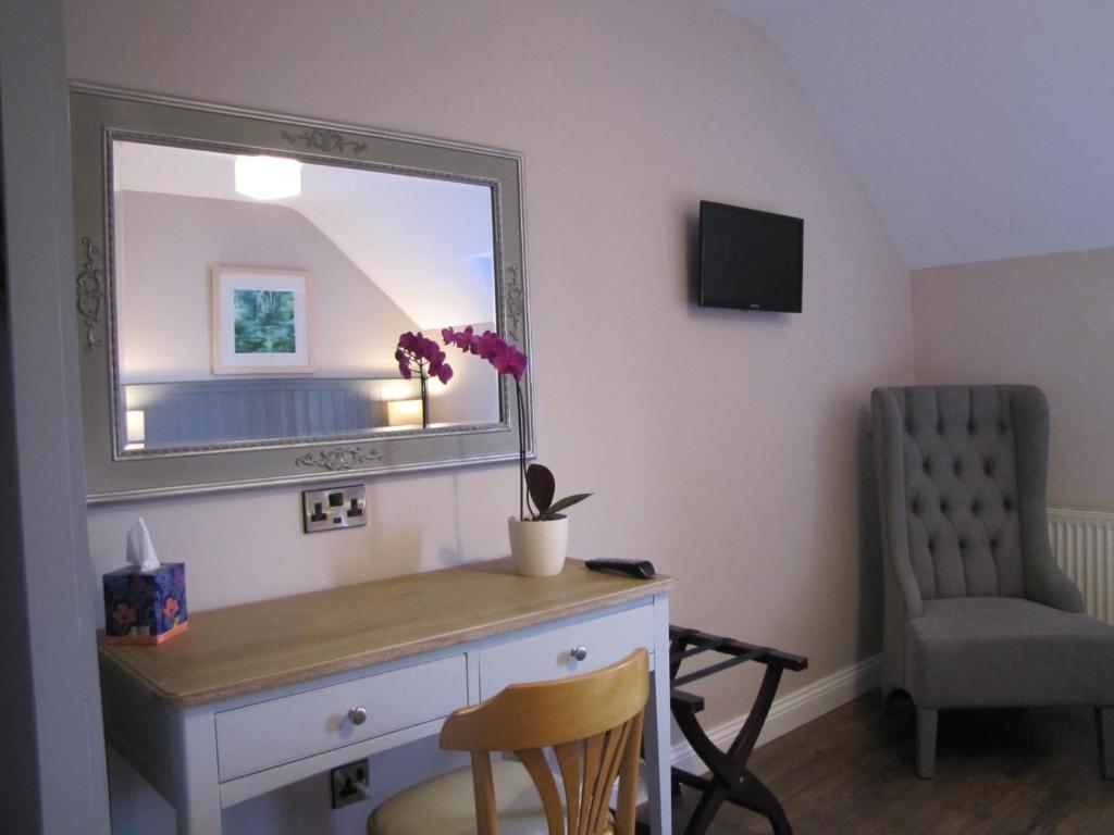 TV a/nebo společenská místnost v ubytování Rolfs Country House