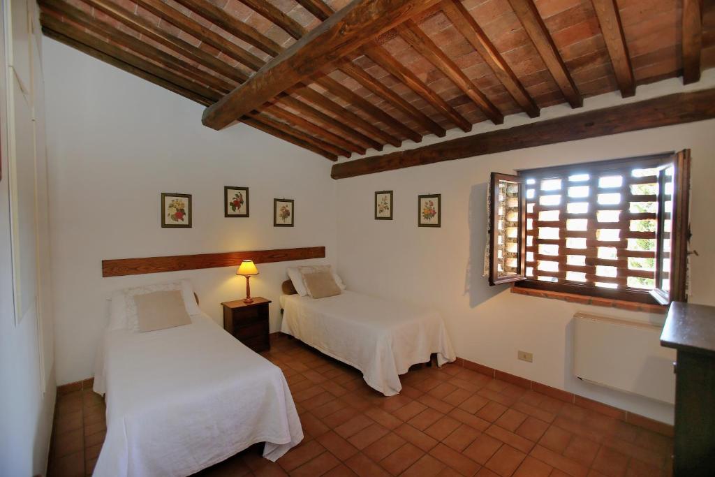 Posteľ alebo postele v izbe v ubytovaní L'Aia Country Holidays
