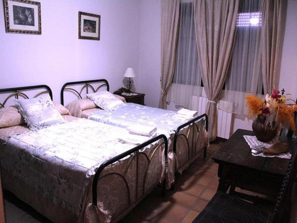 Postel nebo postele na pokoji v ubytování Casa Rural del Puerto de San Vicente