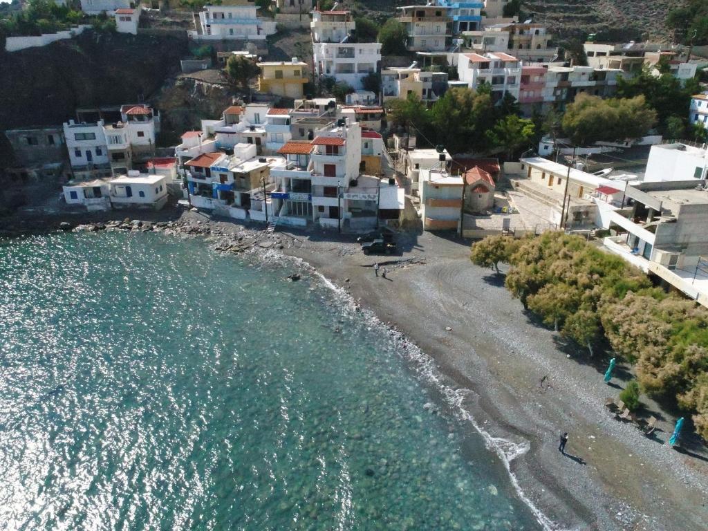 an aerial view of a beach with houses and the water at House With View in Paránimfoi