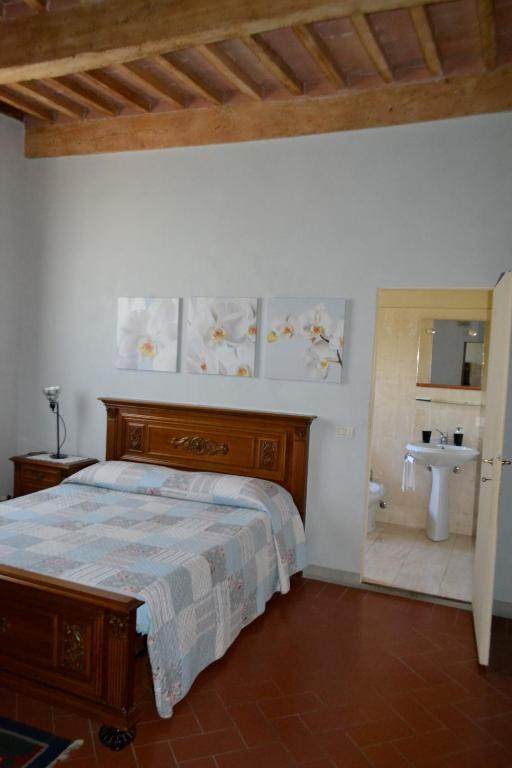 Postel nebo postele na pokoji v ubytování B&B Glicine e Luna