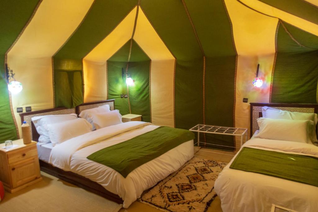 Postel nebo postele na pokoji v ubytování Milky Way Desert Camp