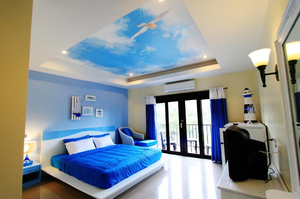 Ein Bett oder Betten in einem Zimmer der Unterkunft Coco Nori @ Sea Resort