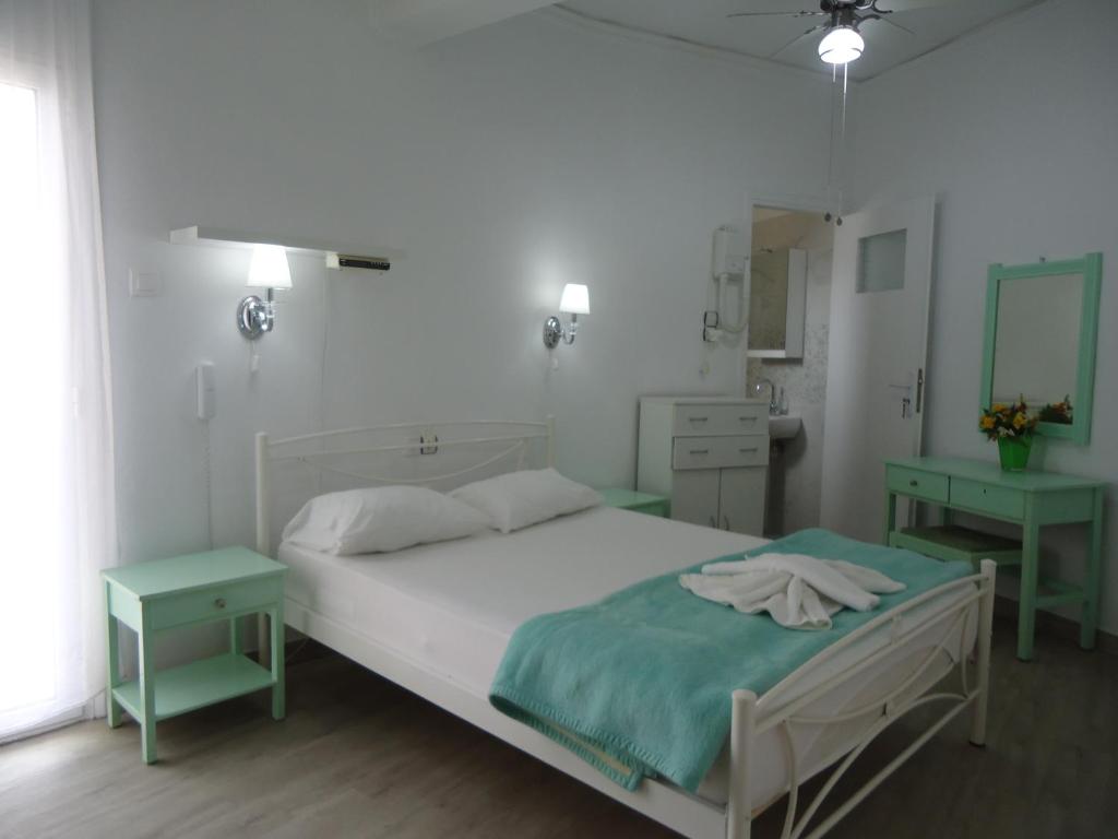 A bed or beds in a room at Kallithea Studios
