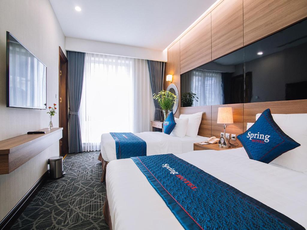 Voodi või voodid majutusasutuse Spring Hotel Hanoi toas