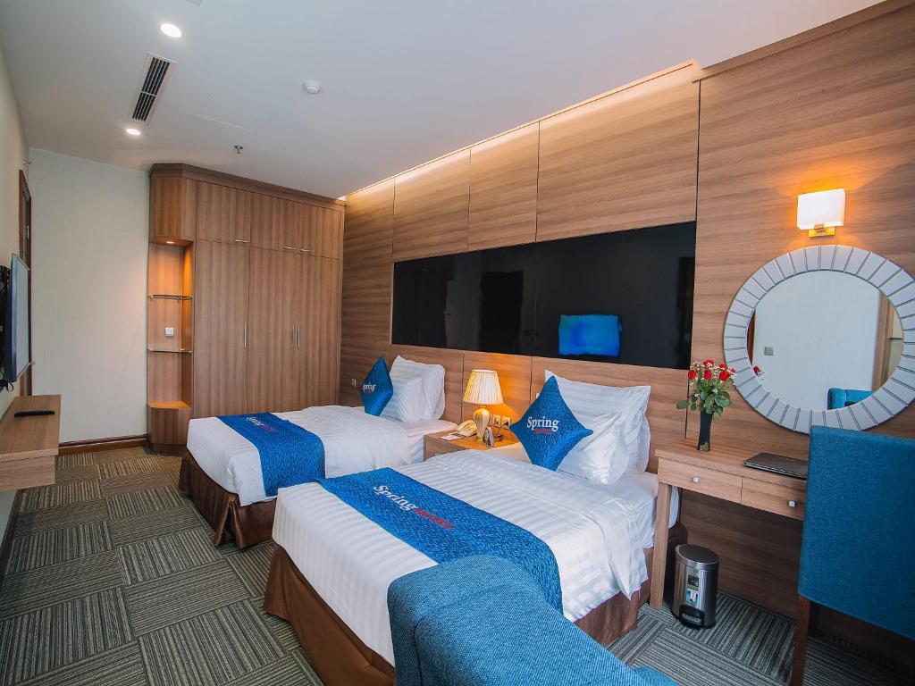 Voodi või voodid majutusasutuse Spring Hotel Hanoi toas