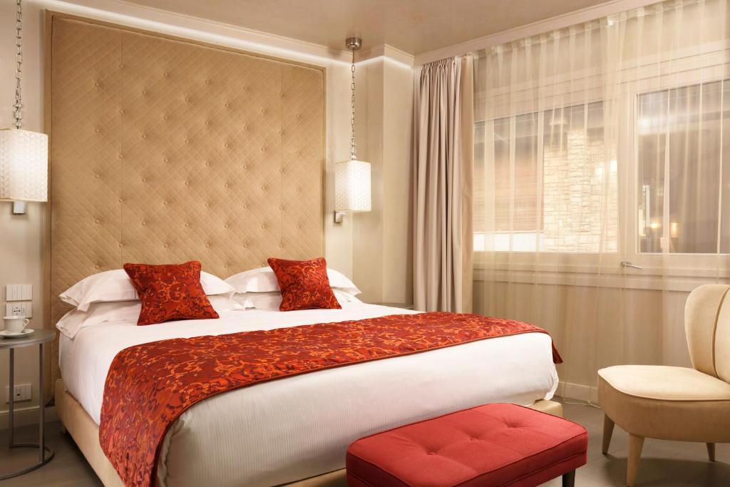 Postel nebo postele na pokoji v ubytování Ponte Vecchio Suites & Spa