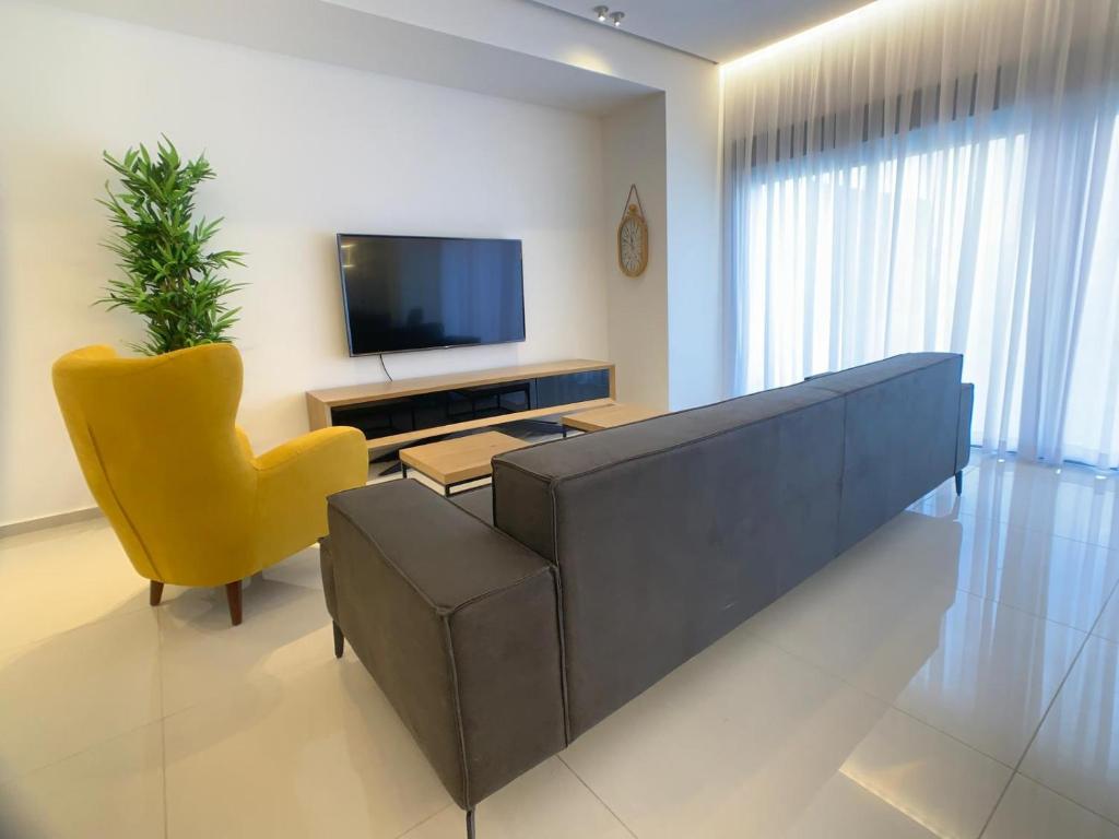 TV a/nebo společenská místnost v ubytování villalis bay view
