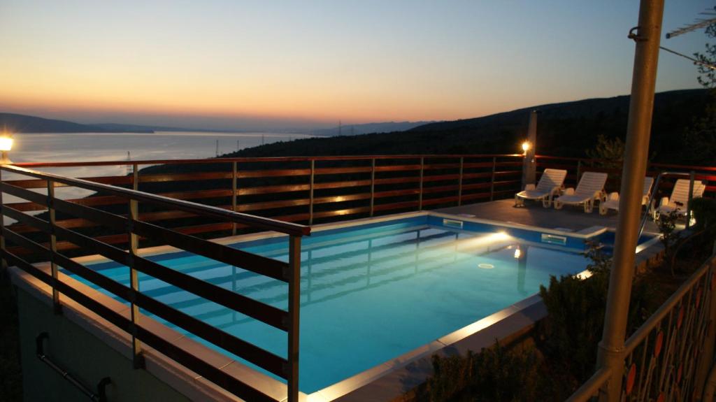 a swimming pool on top of a building at Vacation home TEA in Senj