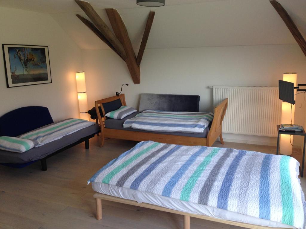 Postel nebo postele na pokoji v ubytování Bauernhaus Pledlberg