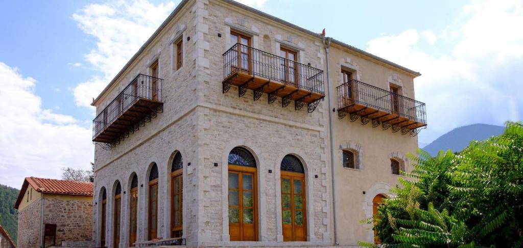 a large building with two balconies on top of it at Great Mantineia in Levidhion