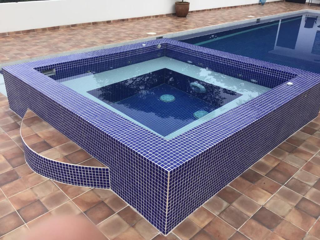 Bazén v ubytování Hotel Los Cielos Del Caribe nebo v jeho okolí