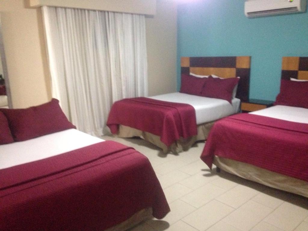 Postel nebo postele na pokoji v ubytování Metro Hotel Panama