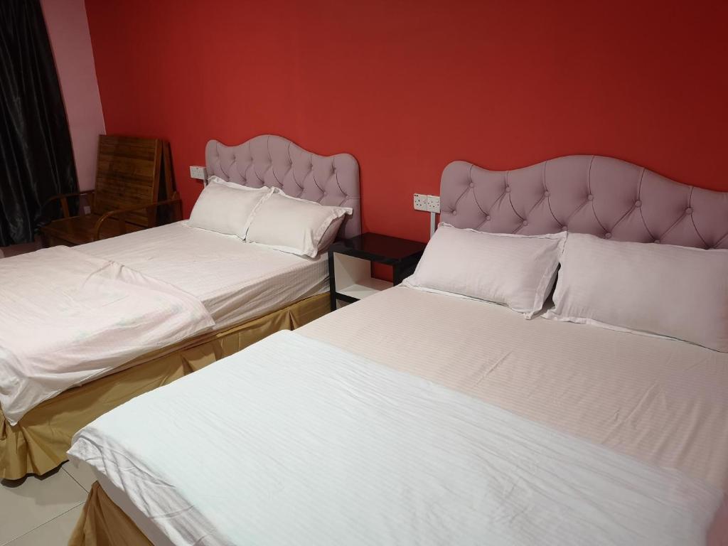 Postel nebo postele na pokoji v ubytování Home Inn Hotel