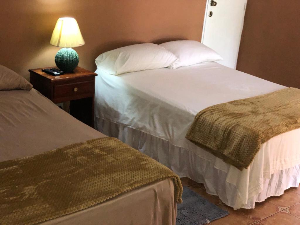 Cama ou camas em um quarto em Cabañas Azuero