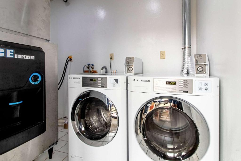 two washing machines and a washer and dryer in a room at Quality Inn & Suites in Dickson