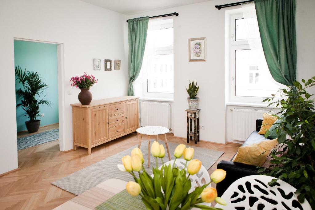 a living room with a couch and a table at Twin Apartment in Vienna