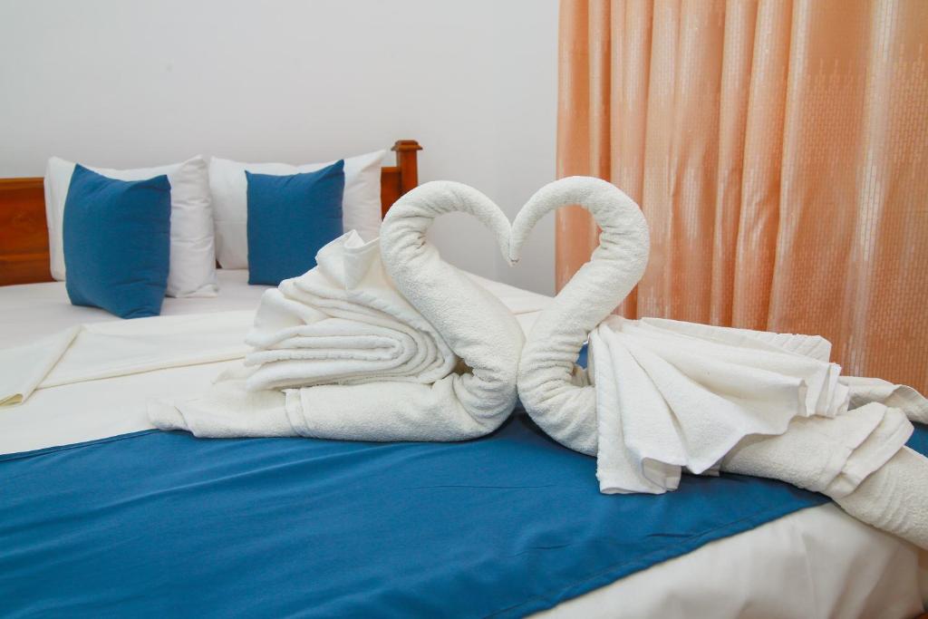 Posteľ alebo postele v izbe v ubytovaní Hotel Sun Blue