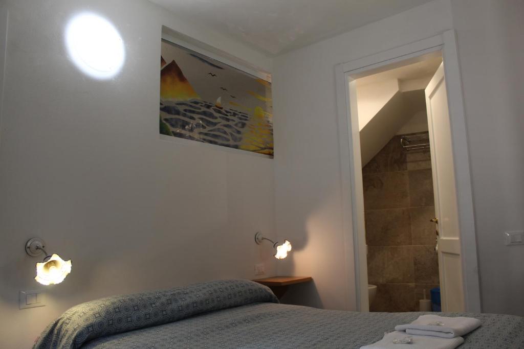 Postel nebo postele na pokoji v ubytování Rina Rooms