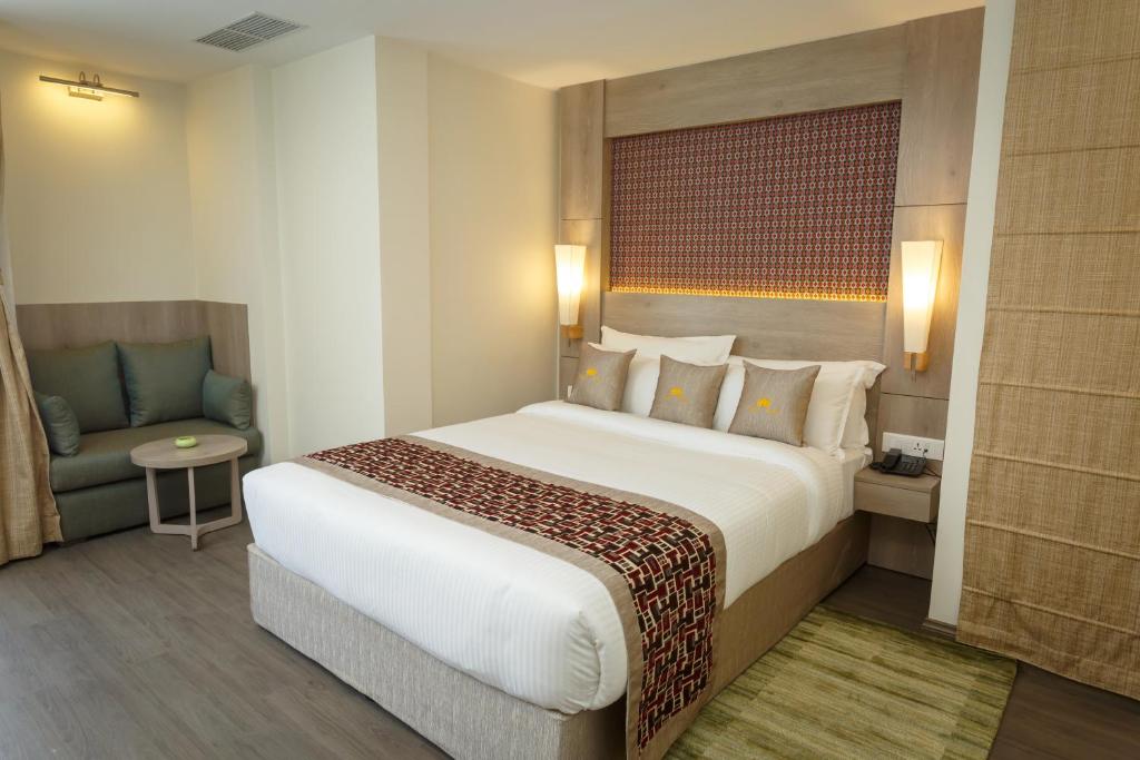 Postel nebo postele na pokoji v ubytování Hotel Crowne Imperial