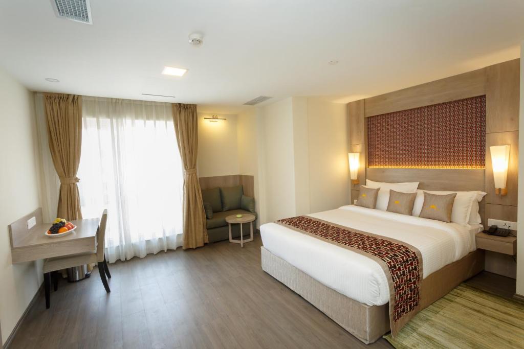 Postel nebo postele na pokoji v ubytování Hotel Crowne Imperial