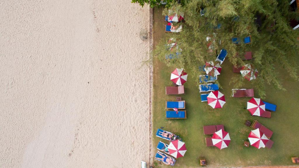 an overhead view of a beach with umbrellas at Royal Lanta Resort & Spa in Ko Lanta