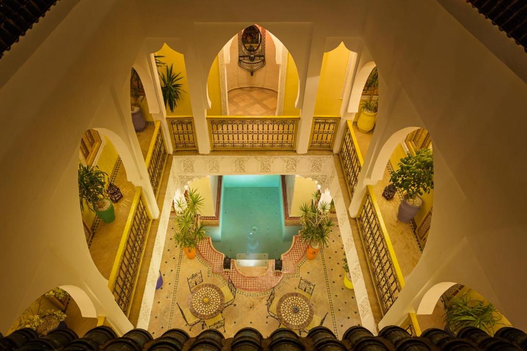 an overhead view of a swimming pool in a building at Riad Sofia in Marrakesh
