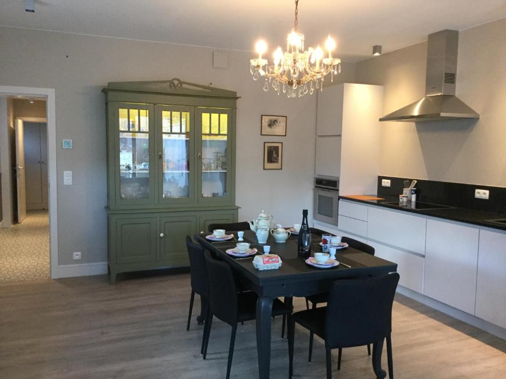 a dining room with a table and chairs in a kitchen at vakantiehuis-oyenkerke 2 in De Panne