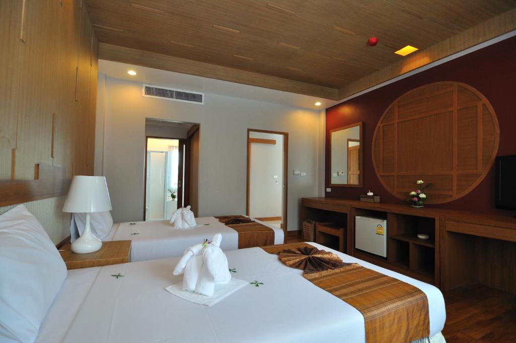 Postel nebo postele na pokoji v ubytování Princess Seaview Resort & Spa - SHA Plus