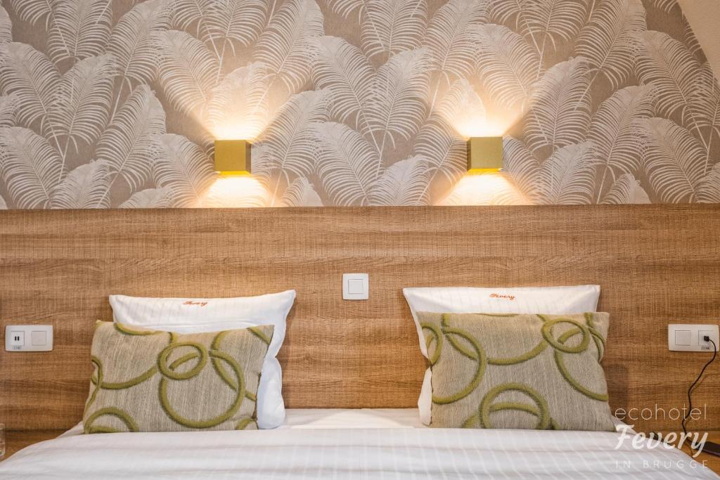 Postel nebo postele na pokoji v ubytování Hotel Fevery