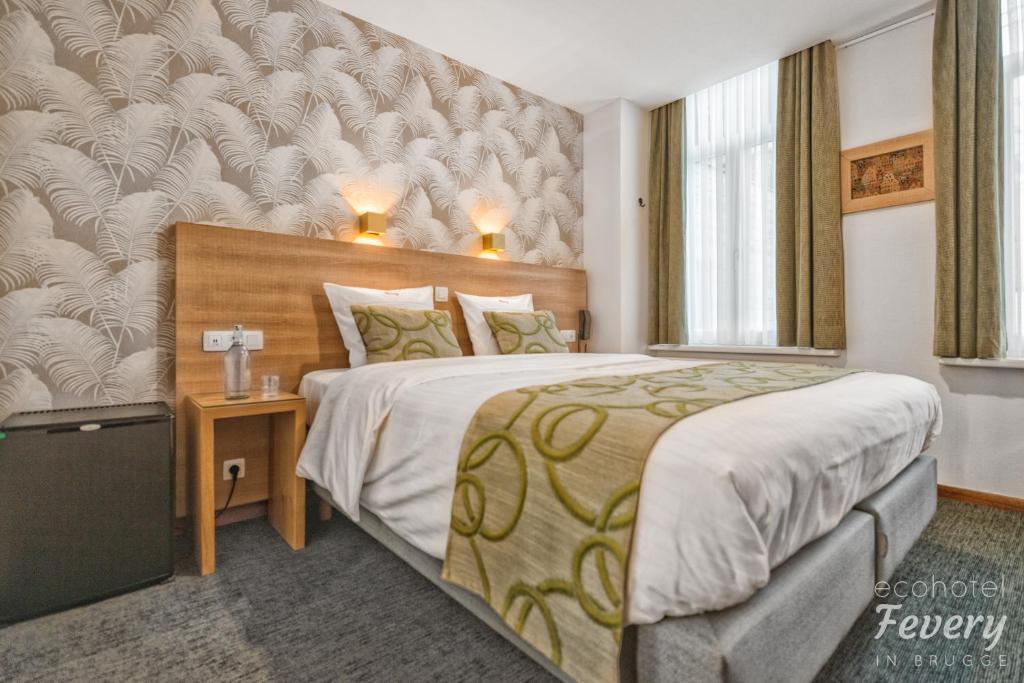 Postel nebo postele na pokoji v ubytování Hotel Fevery