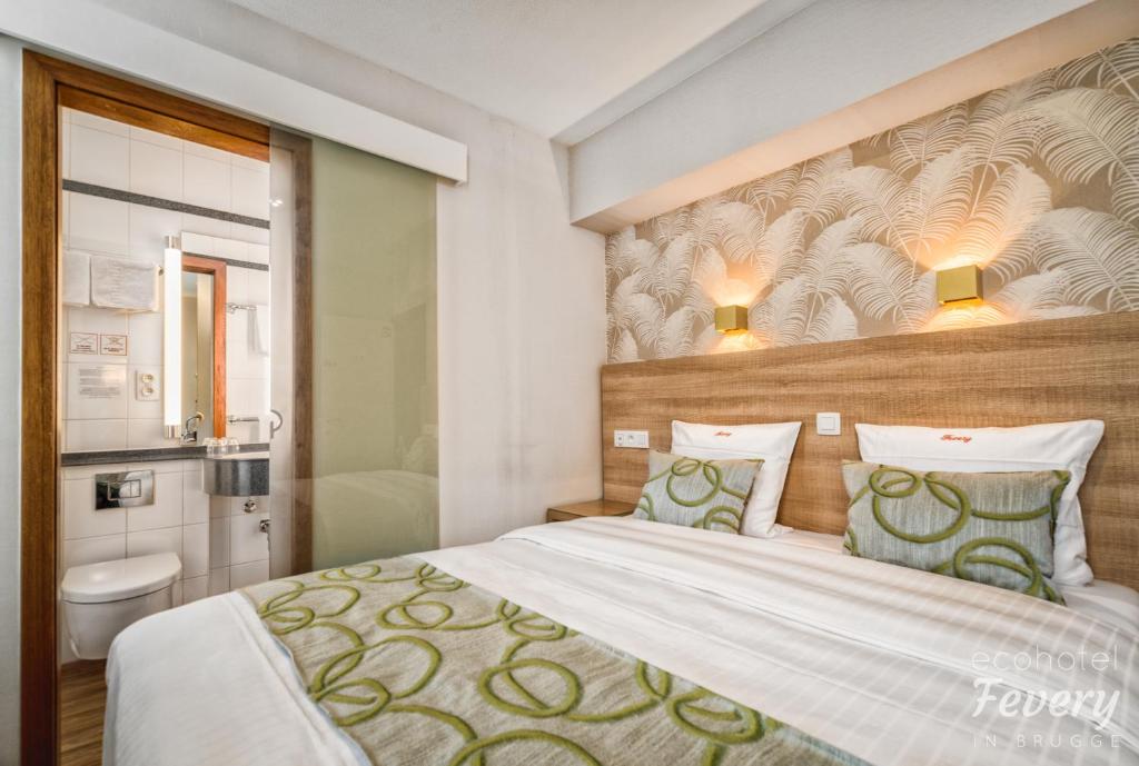 Postel nebo postele na pokoji v ubytování Hotel Fevery