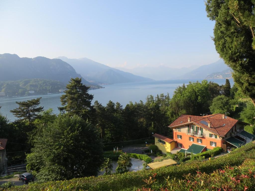 a house on a hill overlooking a lake at Antica Residenza I Ronchi Di Bellagio in Bellagio