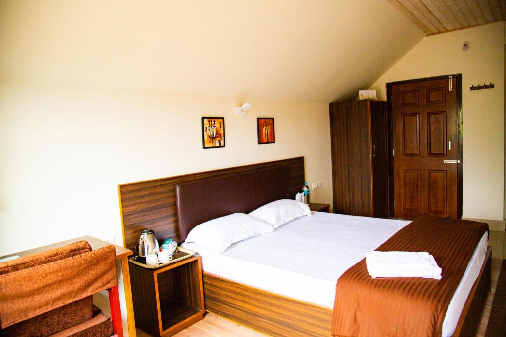 Postel nebo postele na pokoji v ubytování Dreamhome Stay