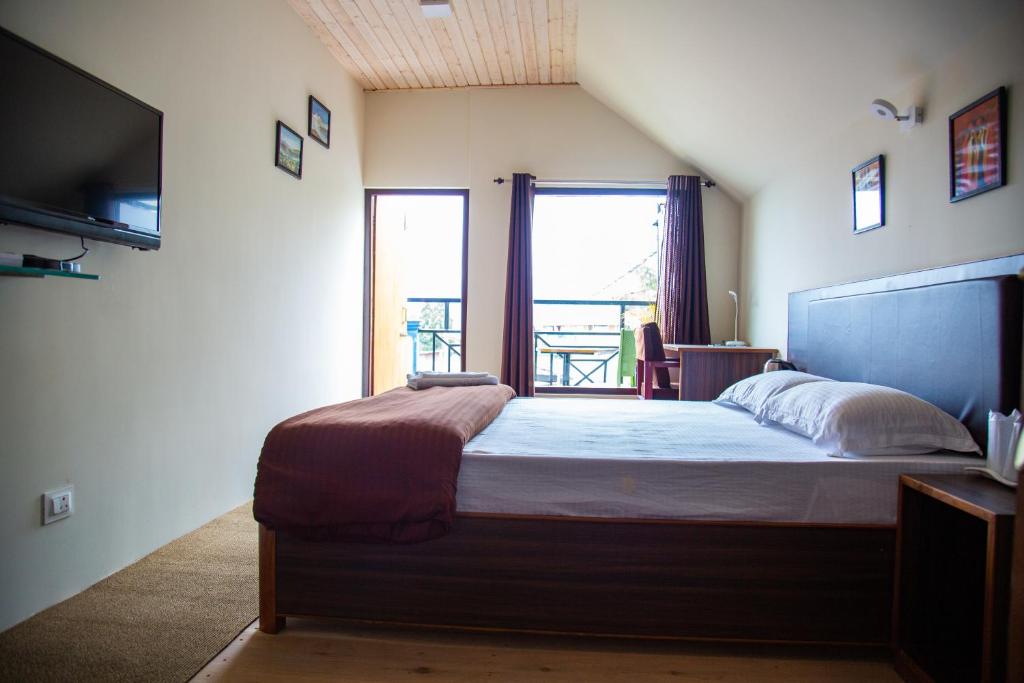 Postel nebo postele na pokoji v ubytování Dreamhome Stay