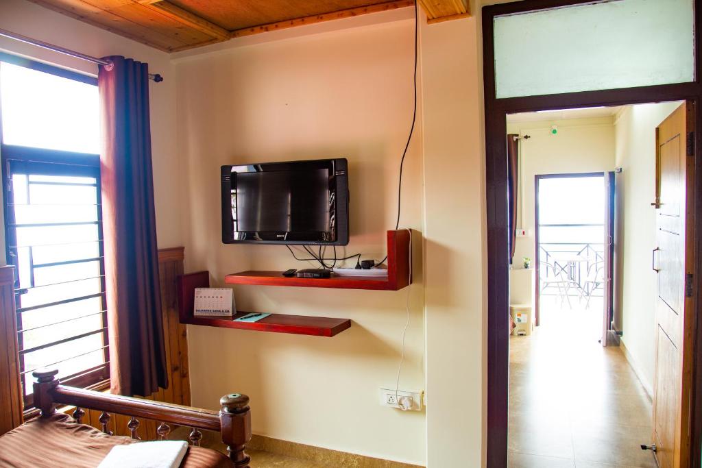 TV a/nebo společenská místnost v ubytování Dreamhome Stay