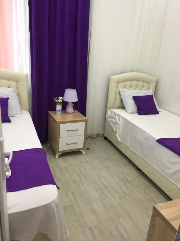 Postel nebo postele na pokoji v ubytování Nikas Guest House