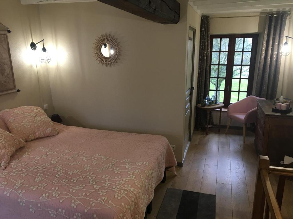 Postel nebo postele na pokoji v ubytování La Commanderie