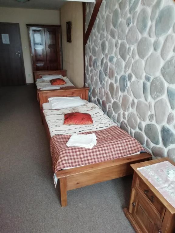 Posteľ alebo postele v izbe v ubytovaní Karczma na Woli