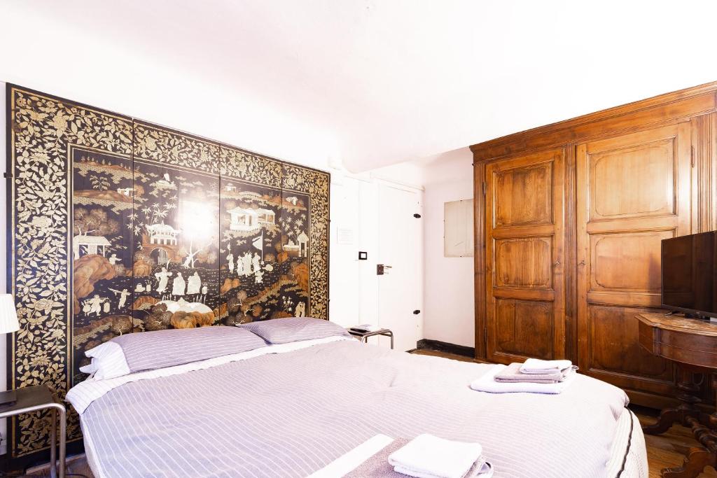 Posteľ alebo postele v izbe v ubytovaní B&B La Casa del Cuoco - Piccola camera con colazione in appartamento condiviso con l'host