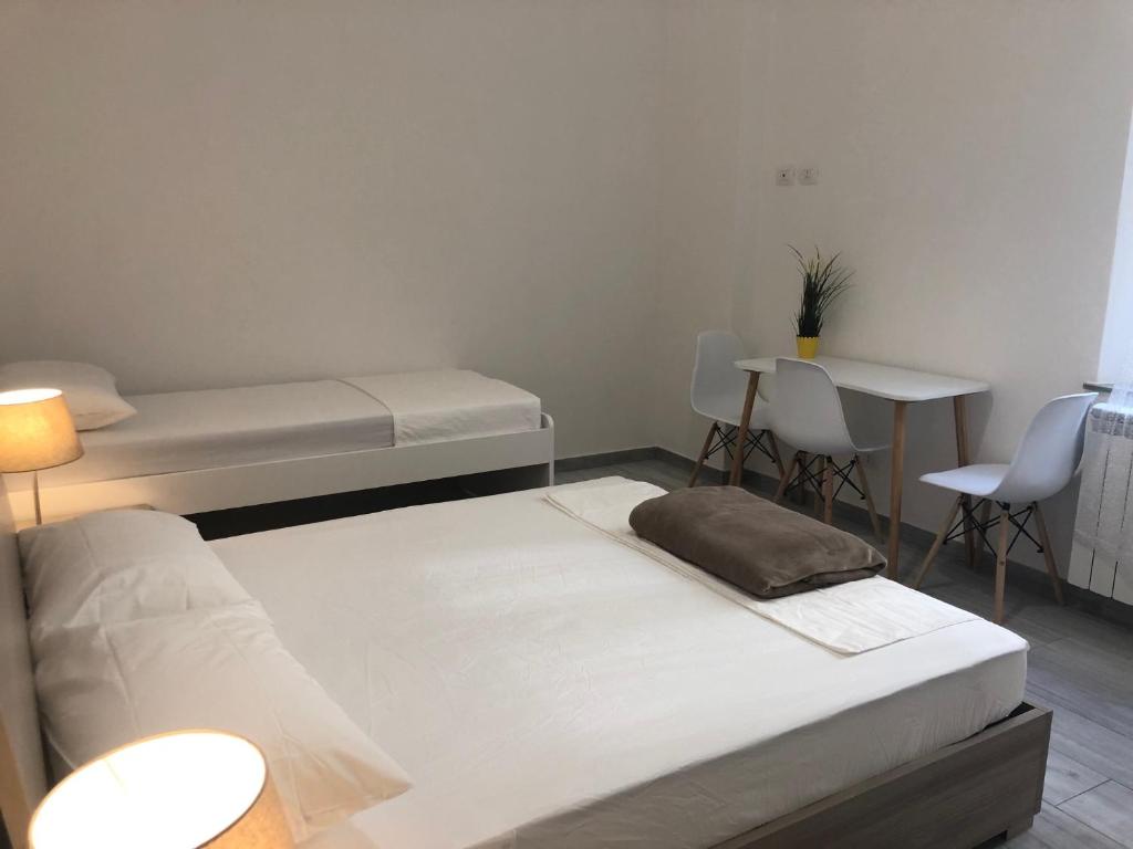 Postel nebo postele na pokoji v ubytování Le Tre Borghesi